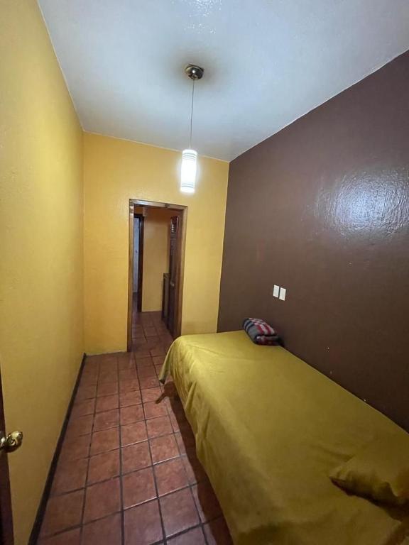 Postel nebo postele na pokoji v ubytování Villas Lupita