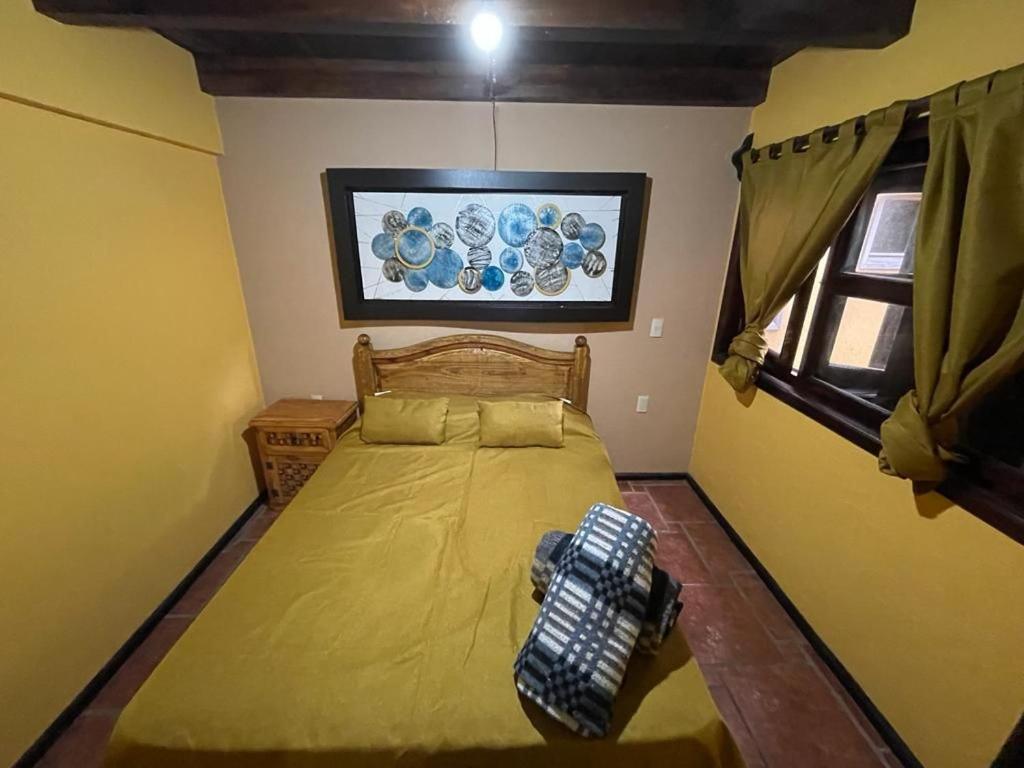 Postel nebo postele na pokoji v ubytování Villas Lupita