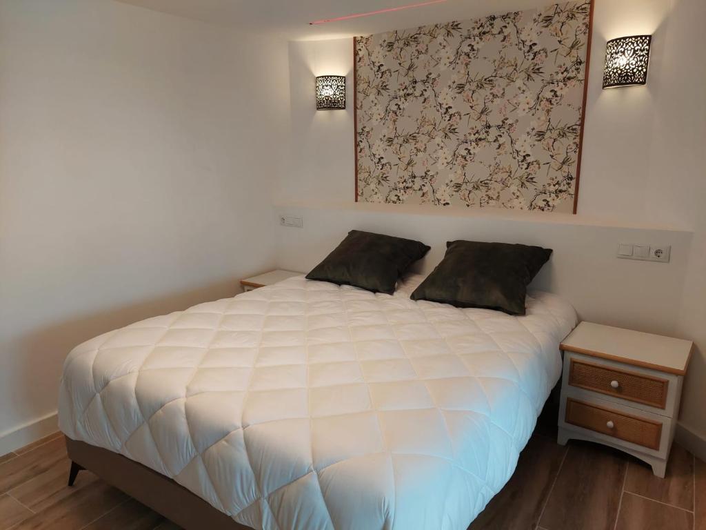 Postel nebo postele na pokoji v ubytování Hostal GARDEN ROUS