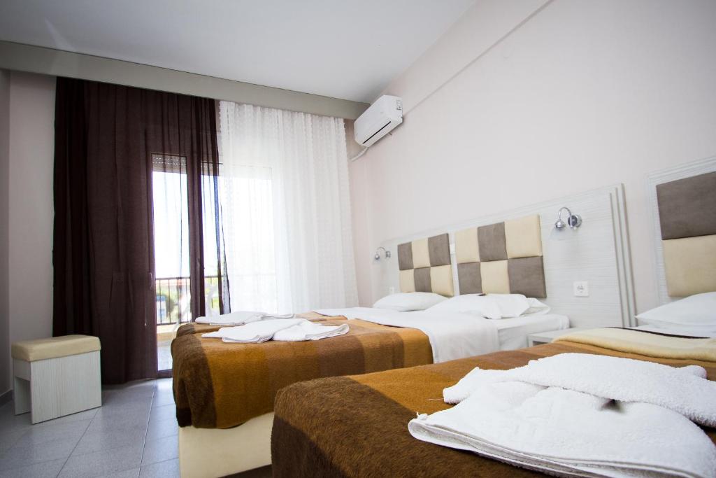 Postel nebo postele na pokoji v ubytování Hotel Maria