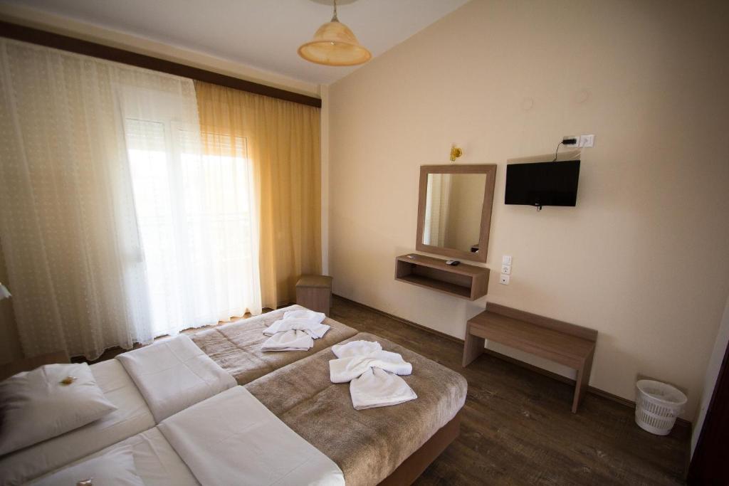 Postel nebo postele na pokoji v ubytování Hotel Maria