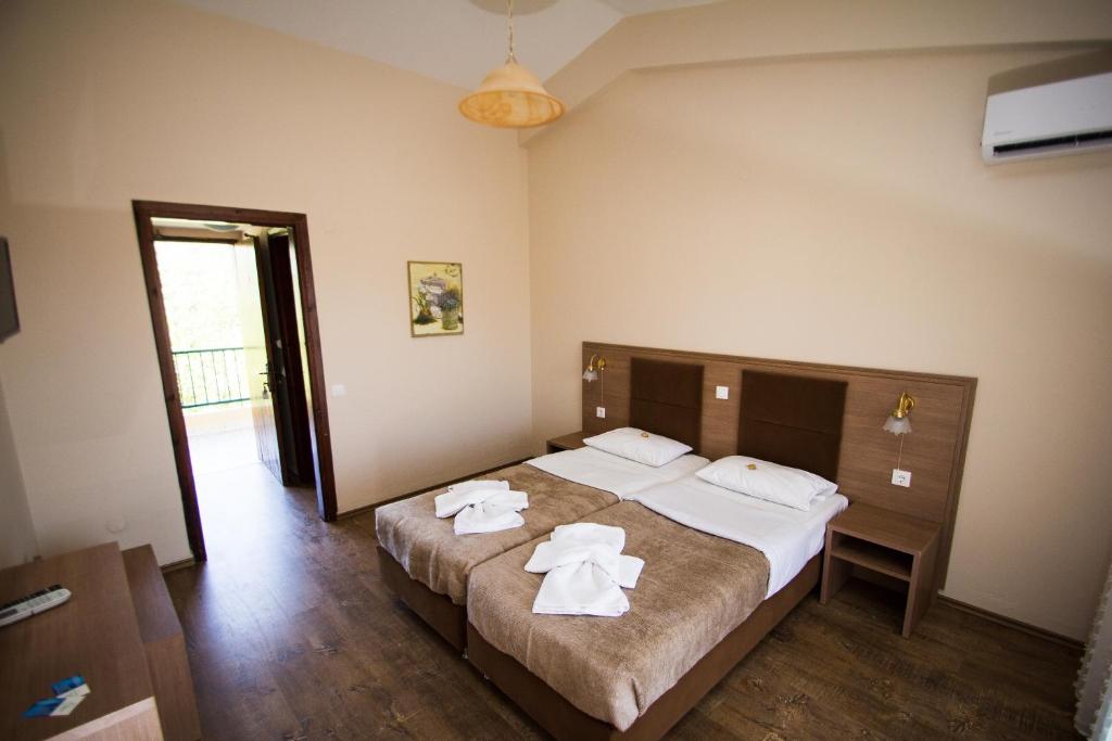Postel nebo postele na pokoji v ubytování Hotel Maria