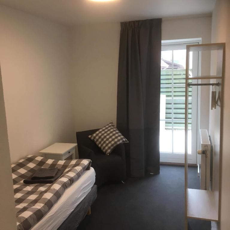 Postel nebo postele na pokoji v ubytování Hotel Osted