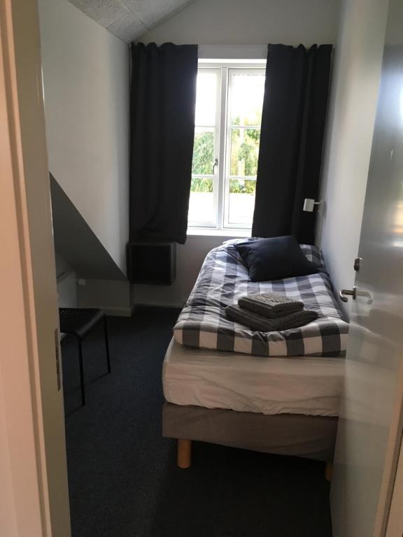 Postel nebo postele na pokoji v ubytování Hotel Osted