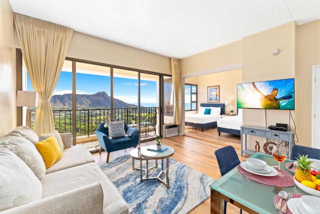 a living room with a view of the mountains at Upscale Penthouse with Ocean Views & Free Parking! in Honolulu
