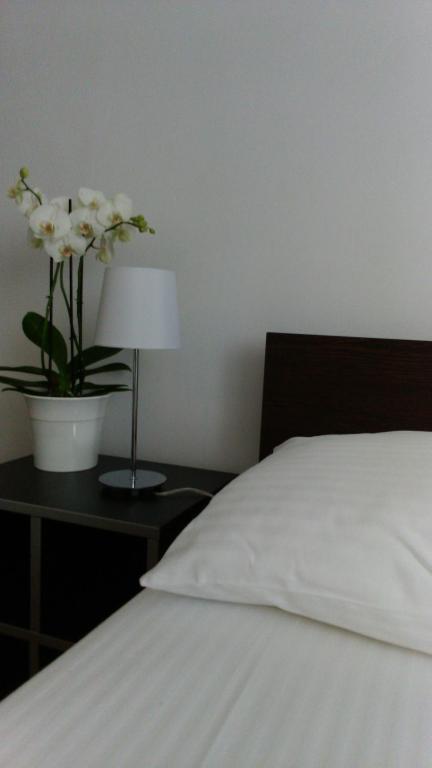 Postel nebo postele na pokoji v ubytování Vrnjci House