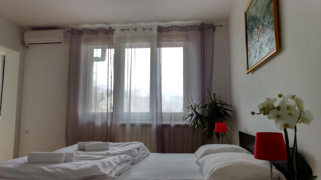 Postel nebo postele na pokoji v ubytování Vrnjci House