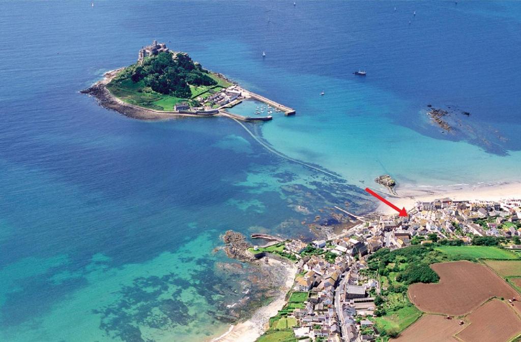an aerial view of a small island in the ocean at Marazion Hotel in Marazion