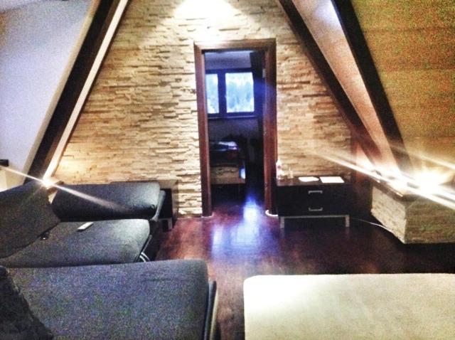 a room with a staircase with chairs and a door at Apartment 111 at Zoned Apart Hotel & Spa - Apartman 111 u hotelu Zoned in Kopaonik