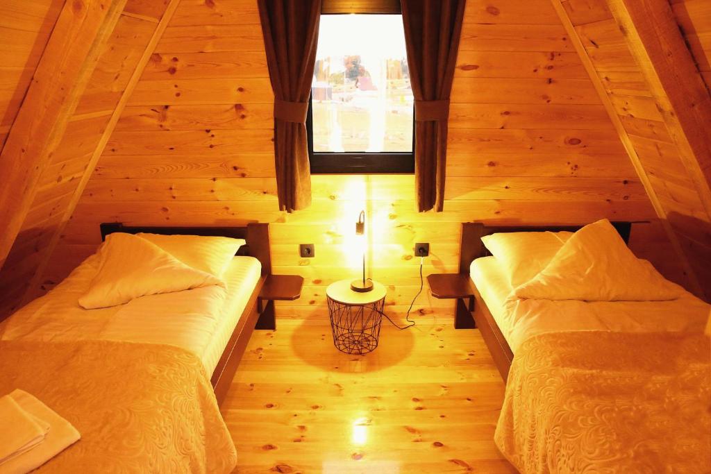 Postel nebo postele na pokoji v ubytování WOLFOREST