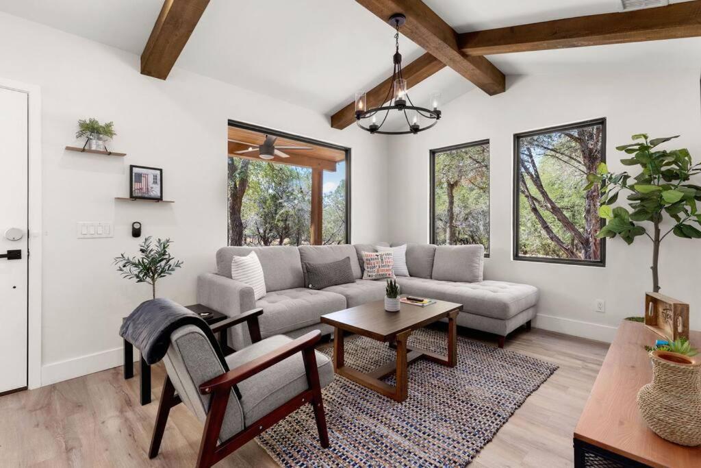 a living room with a couch and a table at Casita 5 minutes from Gruene Hall and King Bed! in New Braunfels