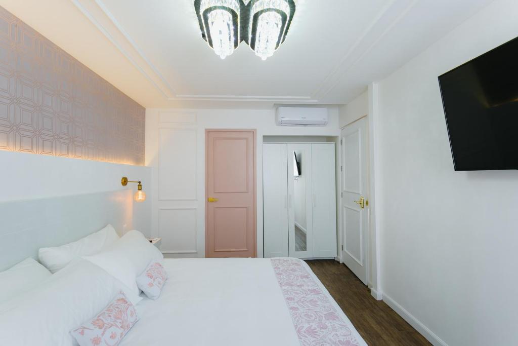 Postel nebo postele na pokoji v ubytování Casa Oxa Hotel