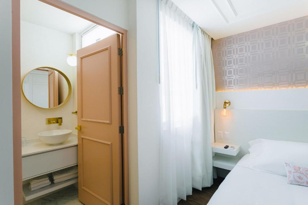 Postel nebo postele na pokoji v ubytování Casa Oxa Hotel