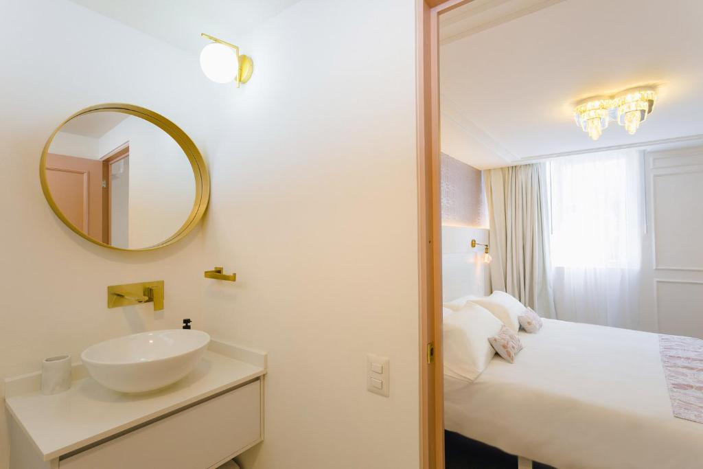 Postel nebo postele na pokoji v ubytování Casa Oxa Hotel