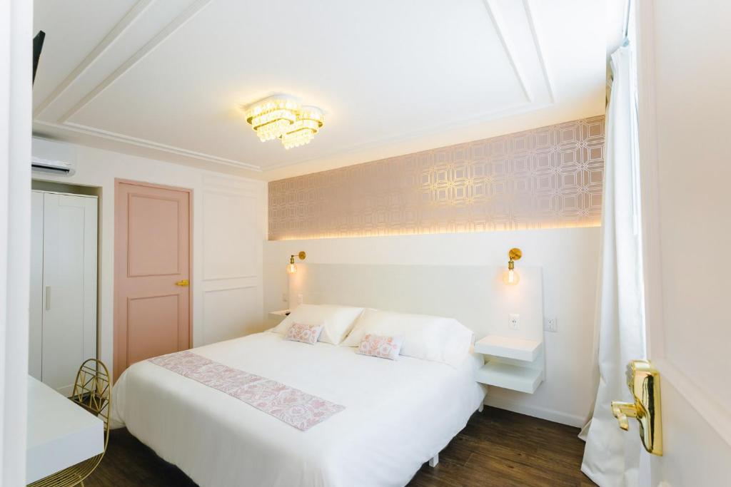 Postel nebo postele na pokoji v ubytování Casa Oxa Hotel