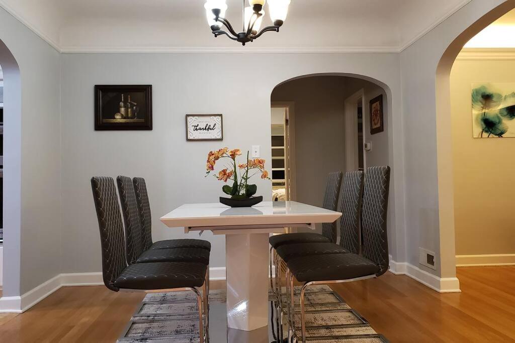 a dining room with a table and four chairs at Cozy Home for Family & Friends Gathering in Beaverton