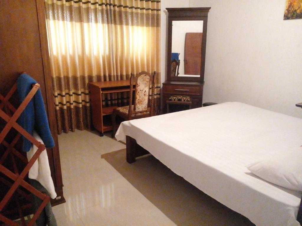 Postel nebo postele na pokoji v ubytování Muthu Villa Sri Lanka
