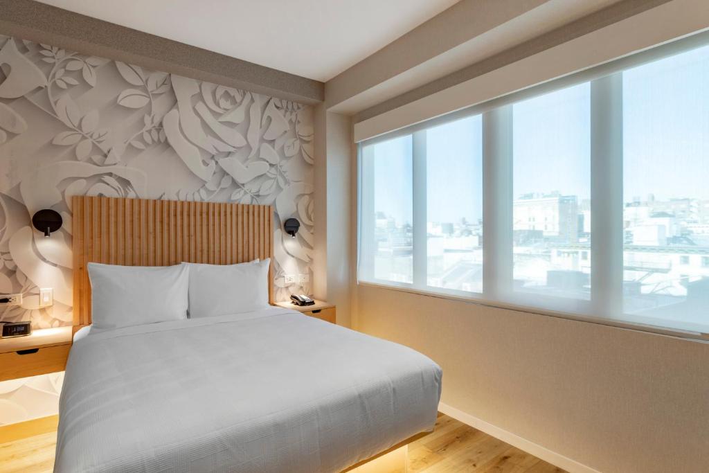 Postel nebo postele na pokoji v ubytování Best Western Plus Soho Hotel