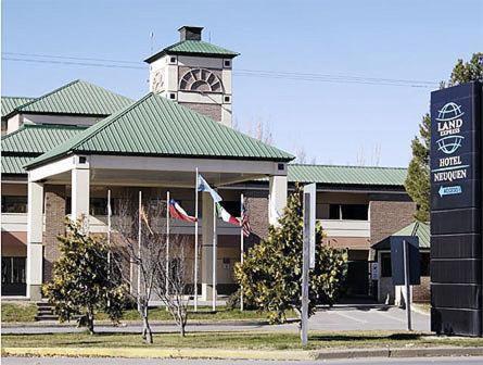 a building with a clock tower on top of it at Land Express Neuquén in Neuquén