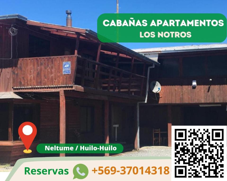 a building with a sign that reads cabanas apartments los norques at Aparamentos Los Notros Neltume Huilo Huilo in Neltume