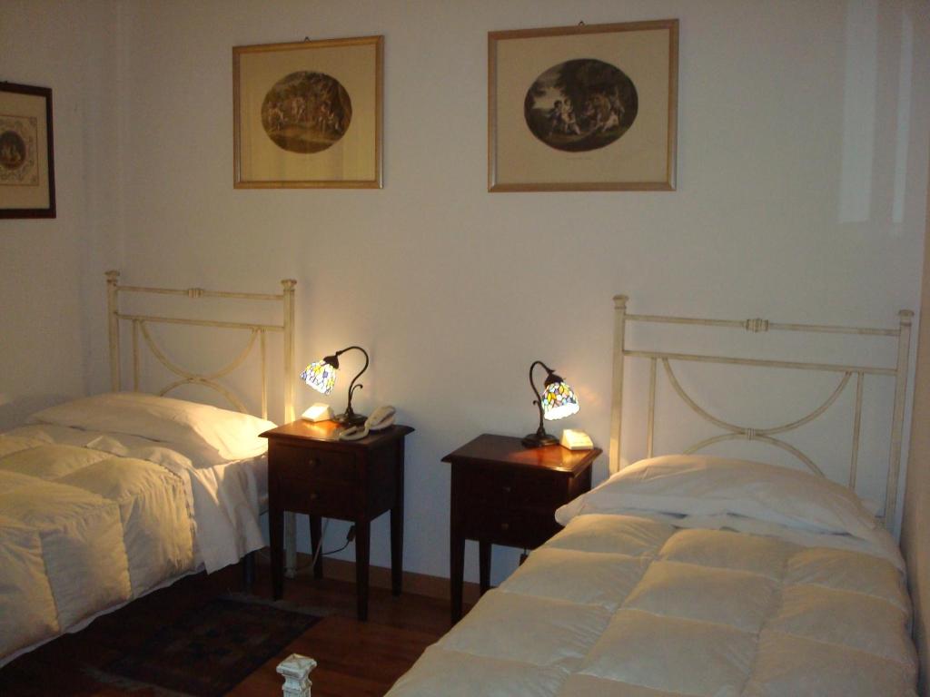Postel nebo postele na pokoji v ubytování Albergo La Sfinge