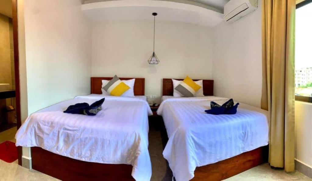 Postel nebo postele na pokoji v ubytování Laluna Guesthouse