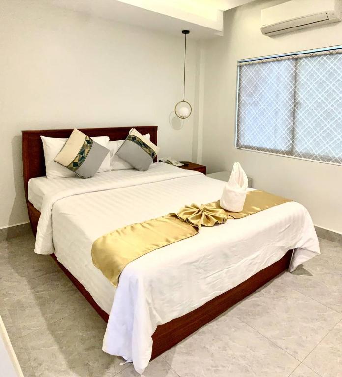 Postel nebo postele na pokoji v ubytování Laluna Guesthouse