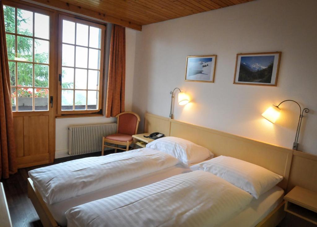 Postel nebo postele na pokoji v ubytování Hotel Alpenruh