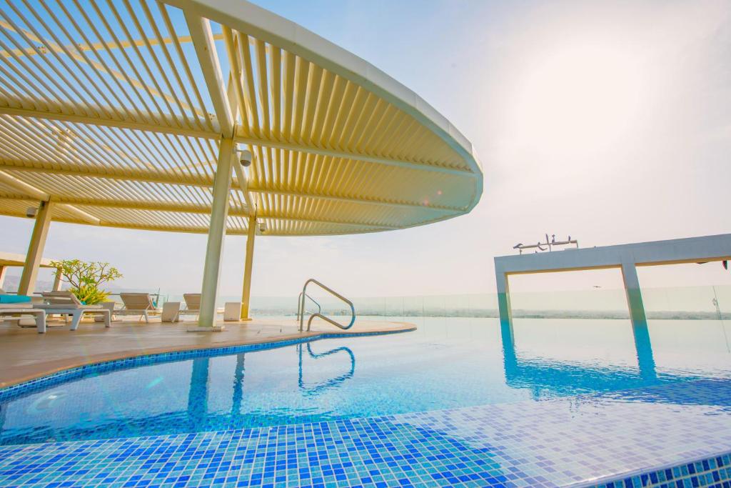 تصویر اتاق‌های Grand Millennium Muscat Apartments and Suites connected to Mall - تصویر ۲