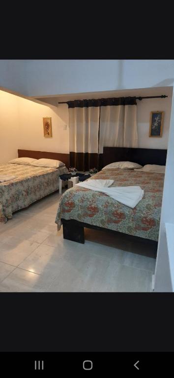 Postel nebo postele na pokoji v ubytování B&B KeisyAlba Punta Rucia