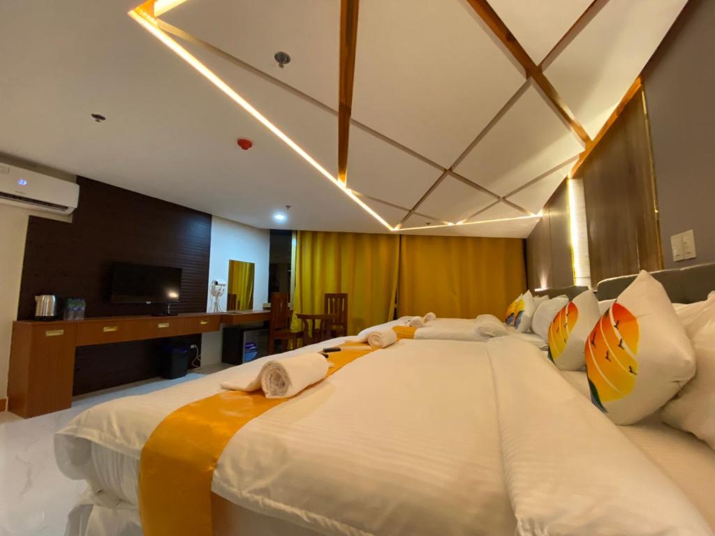 Postel nebo postele na pokoji v ubytování NGN Gran Hotel
