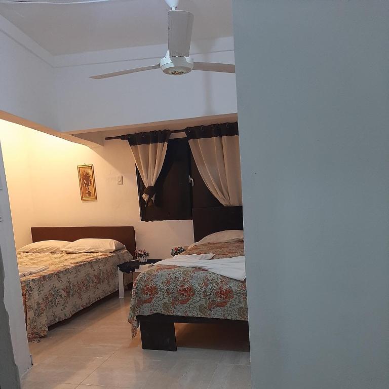 Postel nebo postele na pokoji v ubytování B&B KeisyAlba Punta Rucia