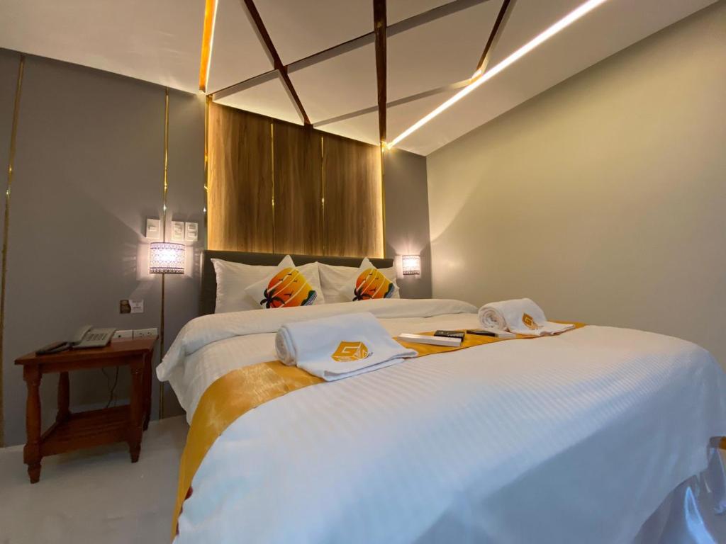 Postel nebo postele na pokoji v ubytování NGN Gran Hotel