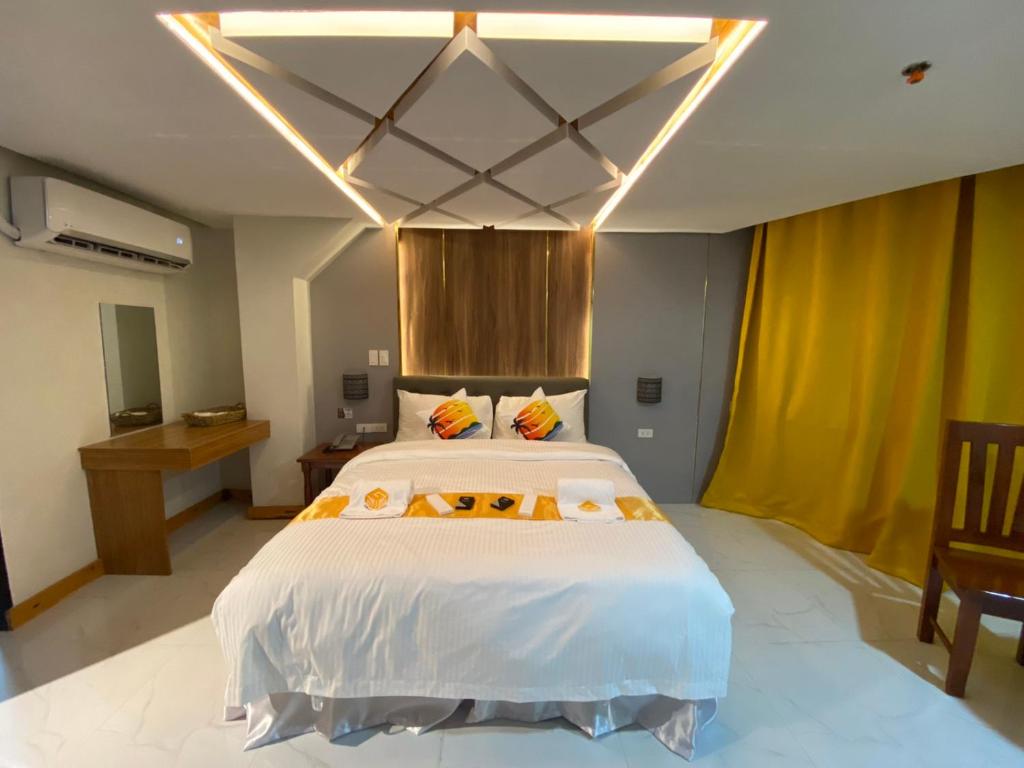 Postel nebo postele na pokoji v ubytování NGN Gran Hotel