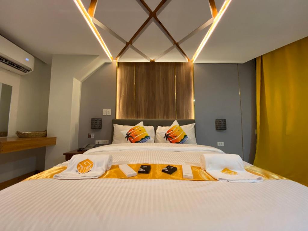 Postel nebo postele na pokoji v ubytování NGN Gran Hotel