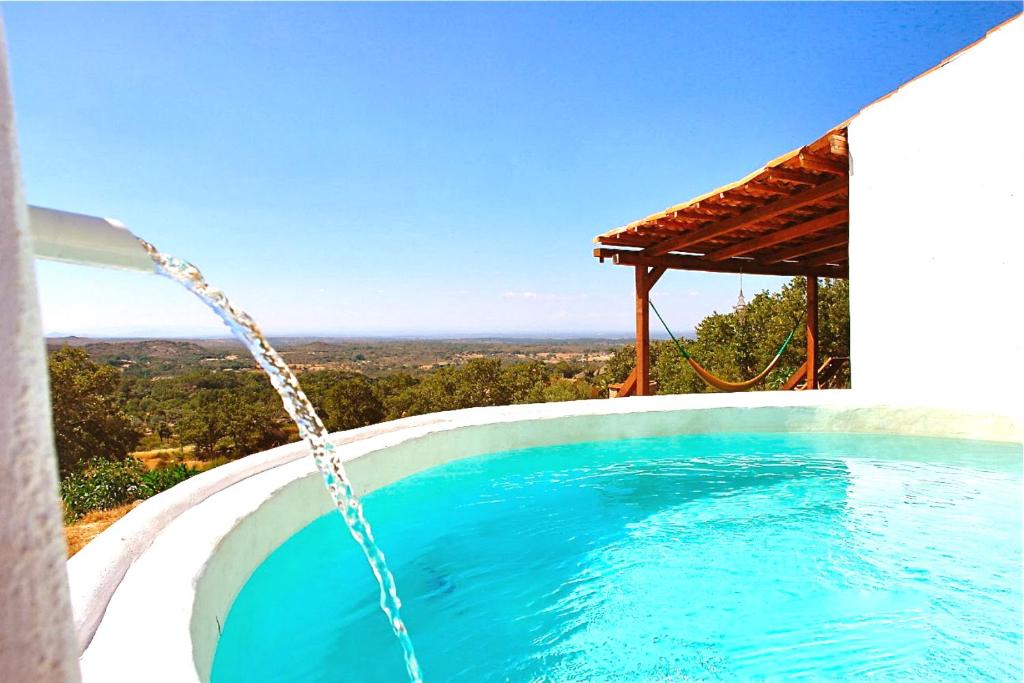 a swimming pool with a water hose at Quinta Do Marvao in Marvão