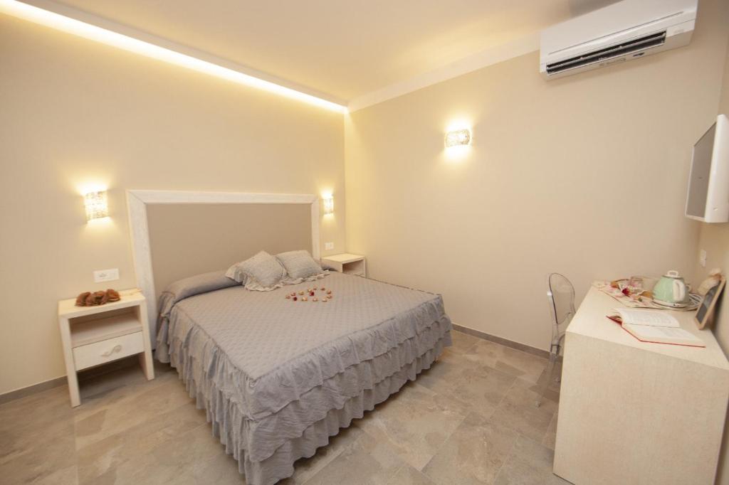 Postel nebo postele na pokoji v ubytování Podere Grandolfi B&B