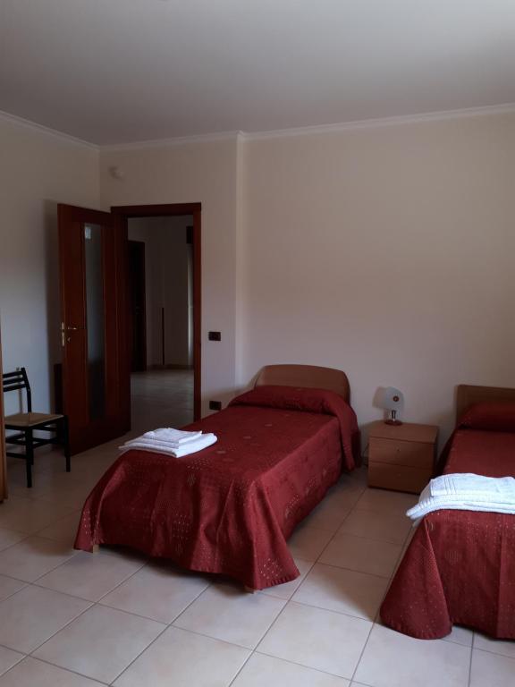 Postel nebo postele na pokoji v ubytování B&B Porta del Gargano
