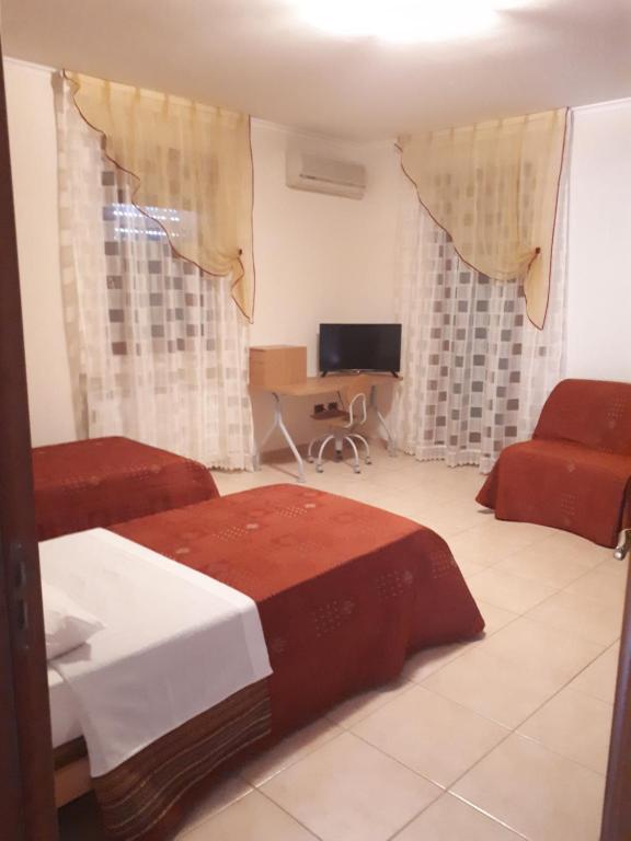 Postel nebo postele na pokoji v ubytování B&B Porta del Gargano