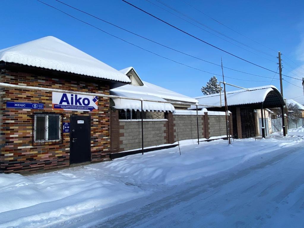 a allico gas station in the snow with snow at "AIKO" Konak Otbasy in Shymkent