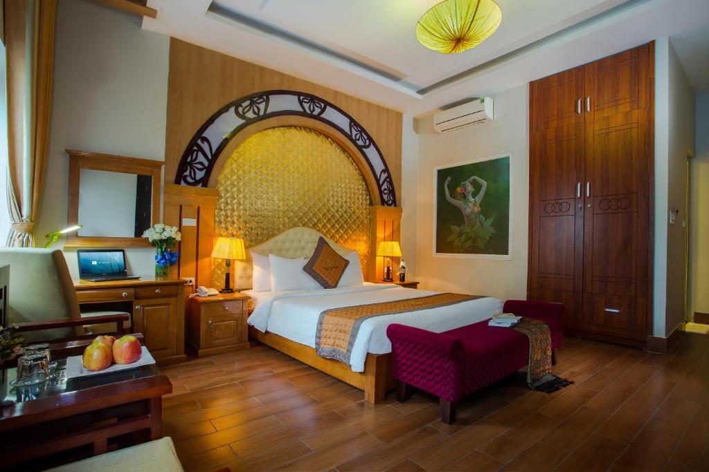 מיטה או מיטות בחדר ב-Vong Xua Boutique Hotel
