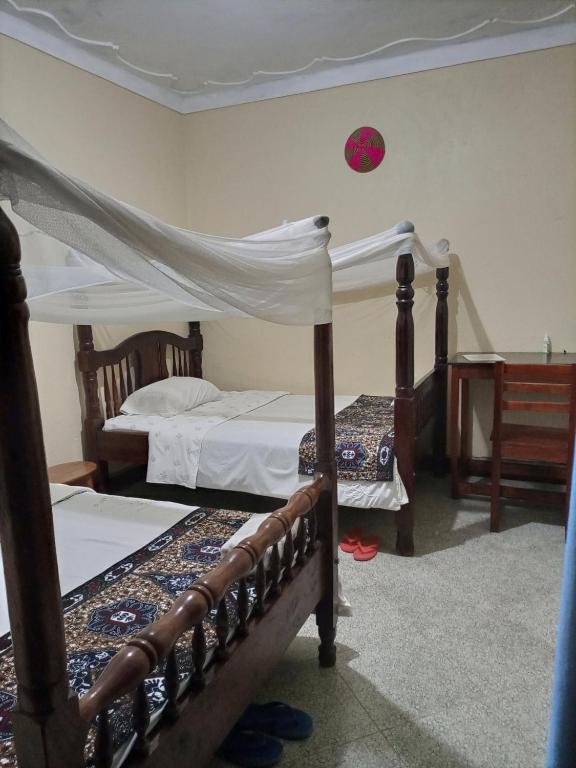 Postel nebo postele na pokoji v ubytování Pross Residence