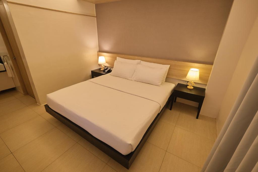 Postel nebo postele na pokoji v ubytování The Tides Hotel Boracay