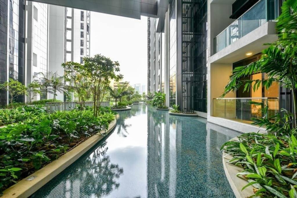 a corridor in a building with a pool of water at Entire Apartment in Kuala Lumpur in Kuala Lumpur
