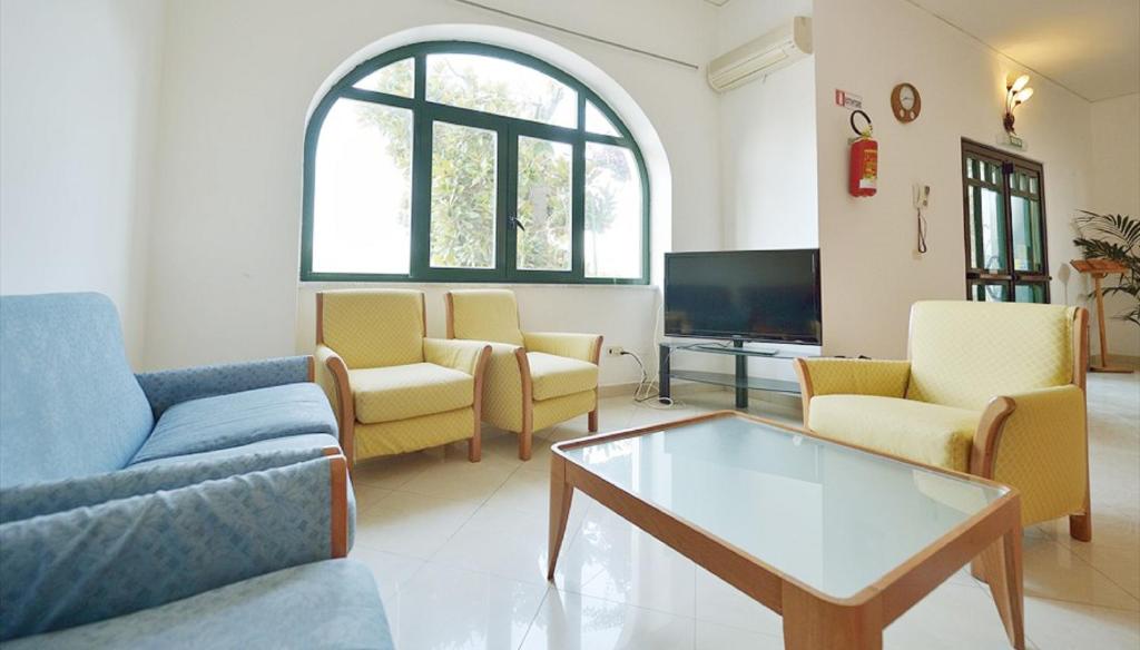 TV a/nebo společenská místnost v ubytování Hotel Riviera