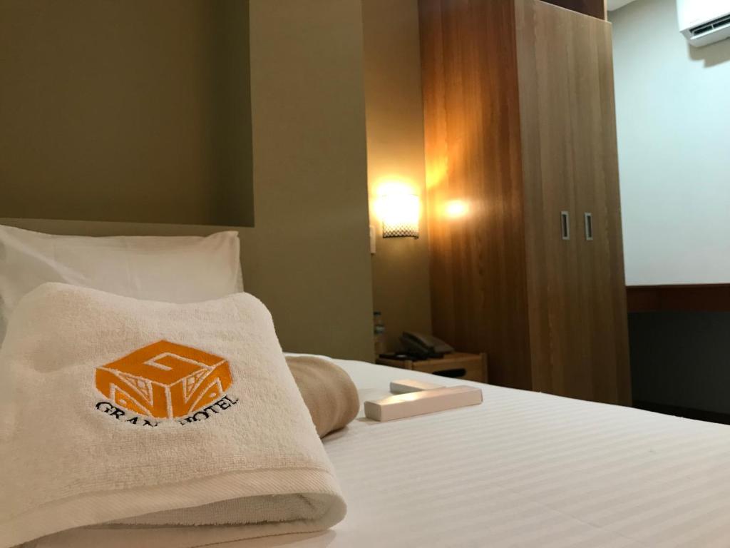 Postel nebo postele na pokoji v ubytování NGN Gran Hotel
