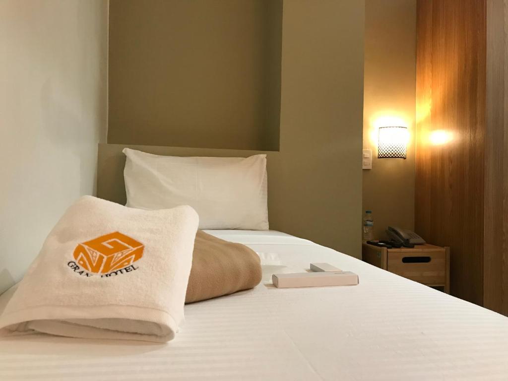 Postel nebo postele na pokoji v ubytování NGN Gran Hotel