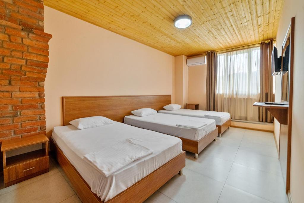 Postel nebo postele na pokoji v ubytování Zedazeni Hotel
