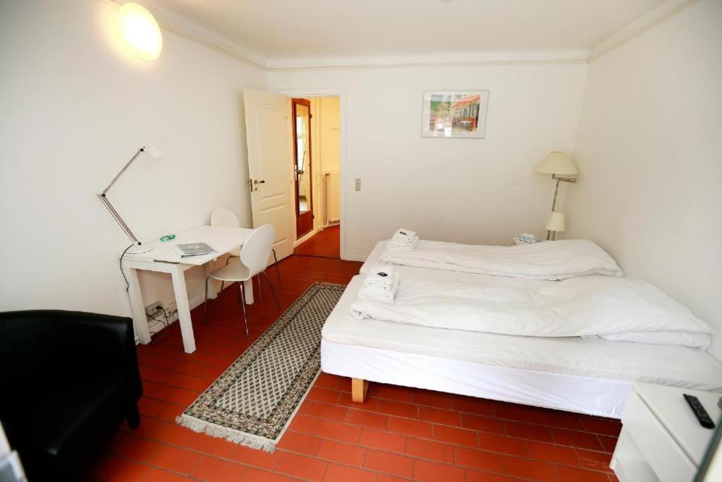Postel nebo postele na pokoji v ubytování Hotel 9 små hjem
