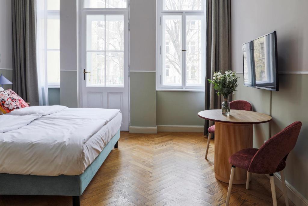 Postel nebo postele na pokoji v ubytování Numa Prague Flow